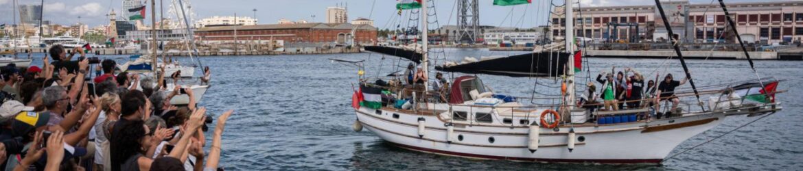 A ship of the Global Sumud Flotilla departing from harbour, as supporters on the dock cheer on and greet it.
